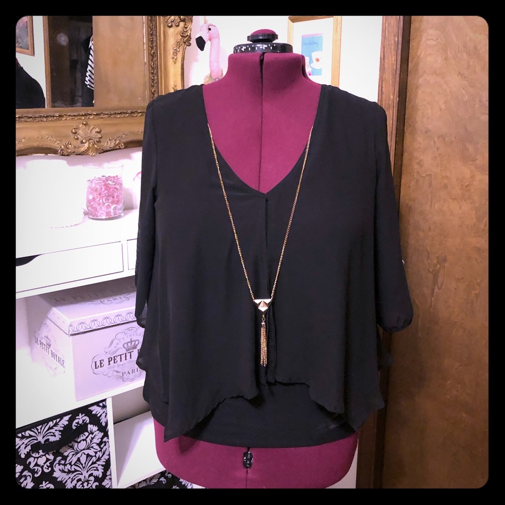 Black top with gold necklace